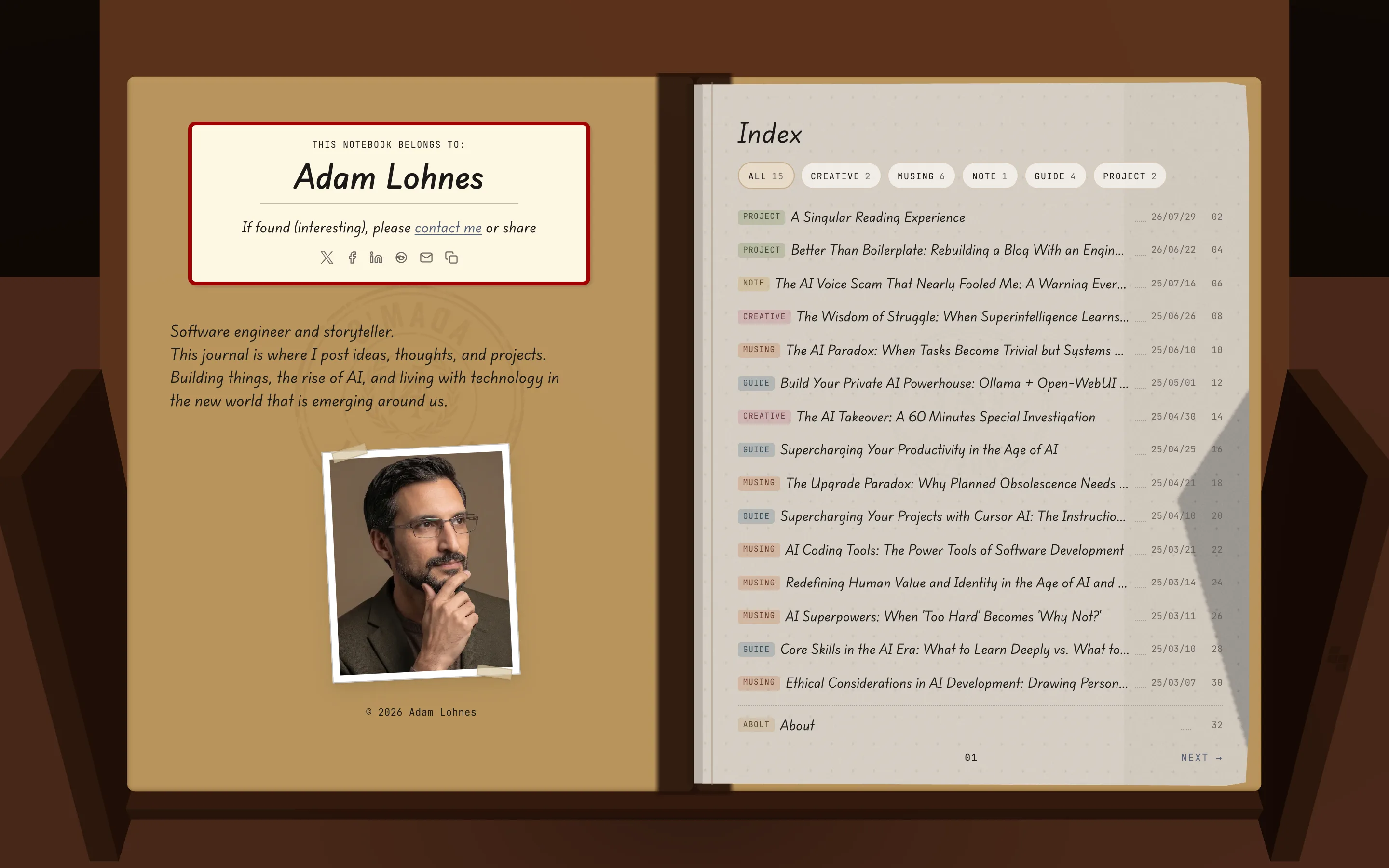Open notebook showing the inside cover and table of contents spread on a wooden desk